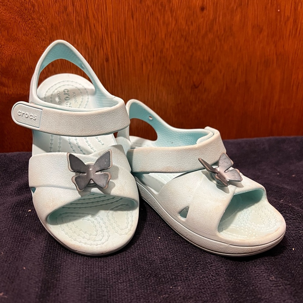 Crocs size 11 “ice blue” cross strap sandals